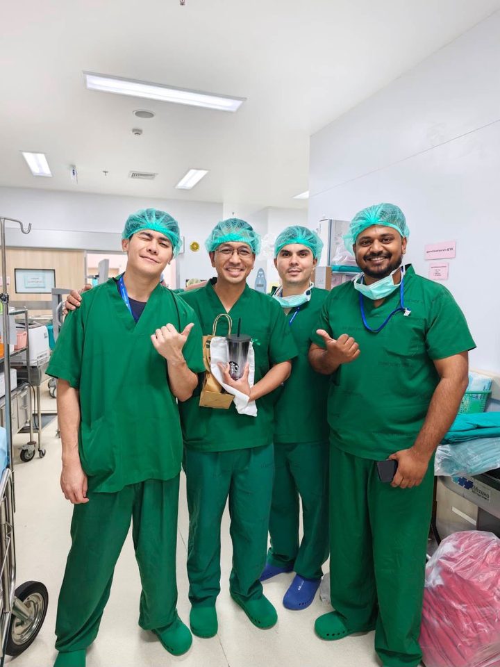 Dr. Bhargav Kuchu with three colleagues in theatre scrubs during the fellowship in Bangkok